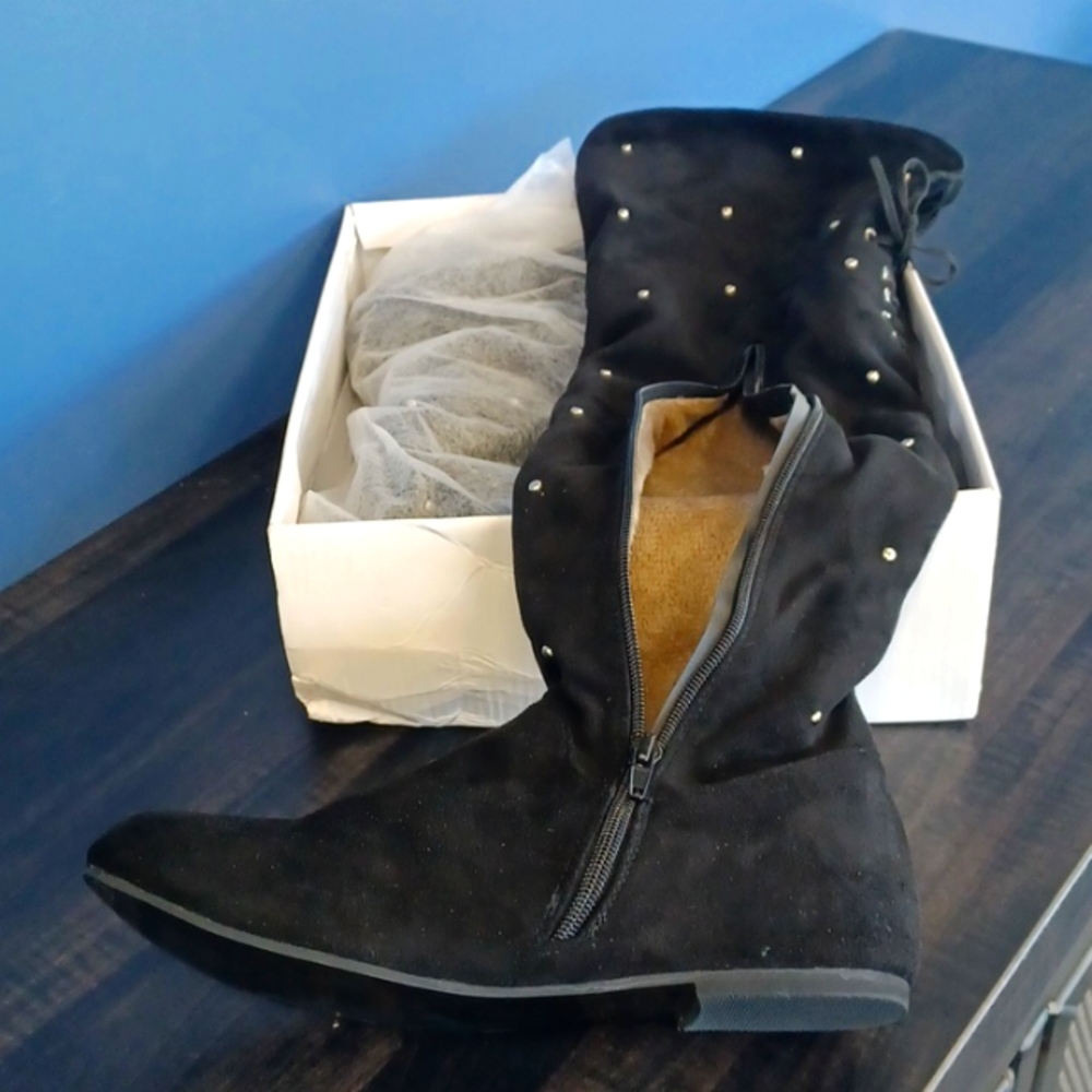 Black knee-high boots.